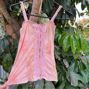 Vintage Y2K pink corset like top with a intricate lace up detailing!